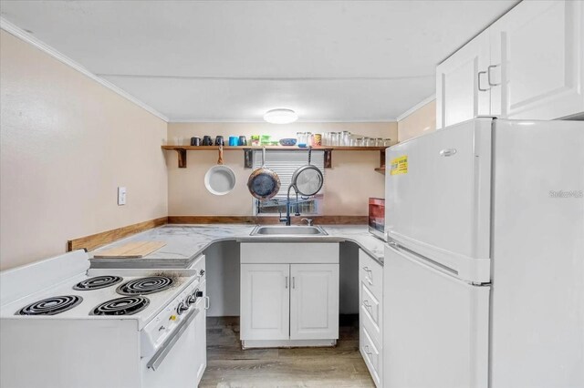 915 S Broadway Unit Ab, Englewood, FL 34223 - kitchen featuring white appliances, a sink, open shelves, ornamental molding, and light wood-type flooring