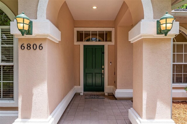 6806 NW 105th Ave, Alachua, FL 32615 - view of exterior entry with stucco siding