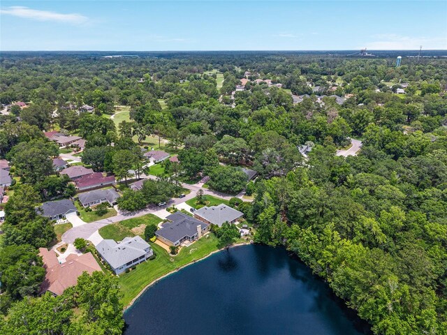 6806 NW 105th Ave, Alachua, FL 32615 - aerial overview of property's location with a nearby body of water, a heavily wooded area, and nearby suburban area
