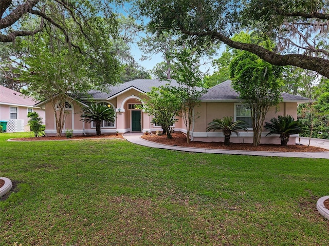 6806 NW 105th Ave, Alachua, FL 32615 - ranch-style home featuring stucco siding and a front yard