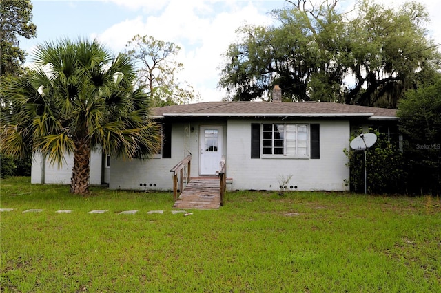 21514 SE 69th Ave, Hawthorne, FL 32640 - view of front facade featuring a front lawn and roof with shingles
