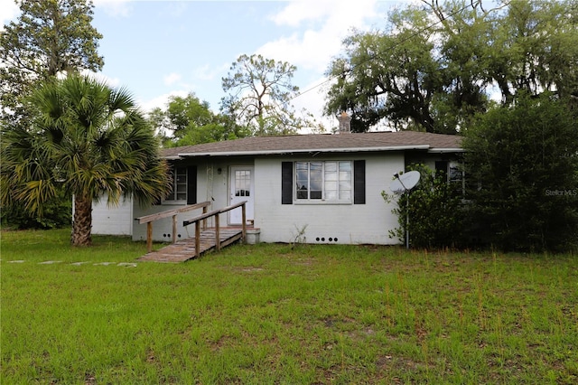 21514 SE 69th Ave, Hawthorne, FL 32640 - view of front facade featuring a front yard and roof with shingles