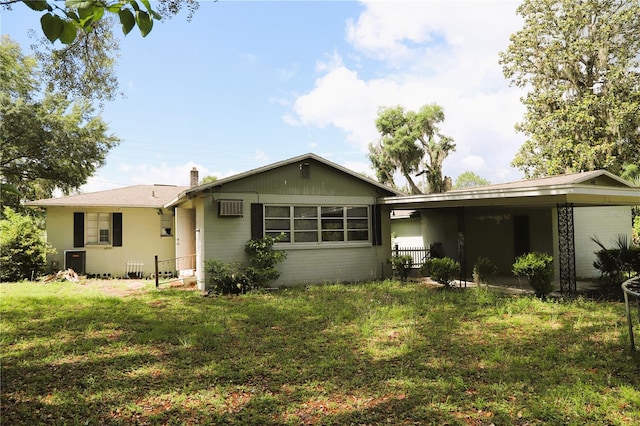 21514 SE 69th Ave, Hawthorne, FL 32640 - rear view of property with a yard, a wall unit AC, and a chimney