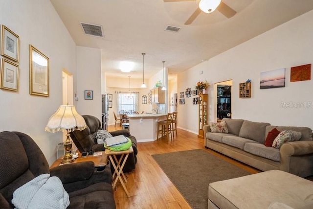 15628 NW 137th Way, Alachua, FL 32615 - living room featuring ceiling fan and light wood finished floors