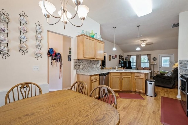 15628 NW 137th Way, Alachua, FL 32615 - kitchen featuring a peninsula, open floor plan, vaulted ceiling, light wood-style floors, and stainless steel dishwasher
