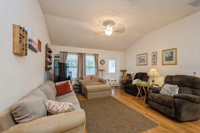 15628 NW 137th Way, Alachua, FL 32615 - living room featuring lofted ceiling, light wood finished floors, and ceiling fan
