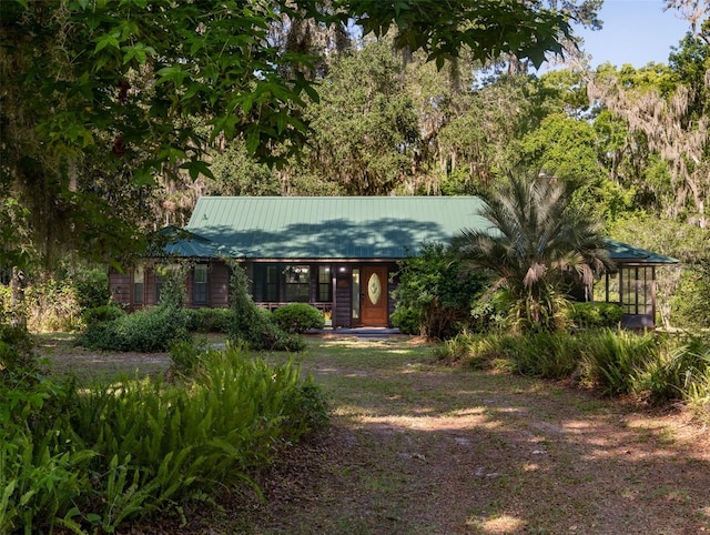 113 Myrtlewood Point Rd, East Palatka, FL 32131 - view of front of home featuring metal roof and covered porch