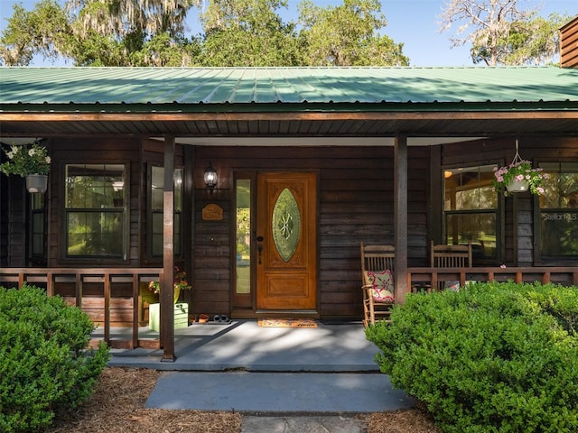 113 Myrtlewood Point Rd, East Palatka, FL 32131 - entrance to property featuring covered porch and metal roof