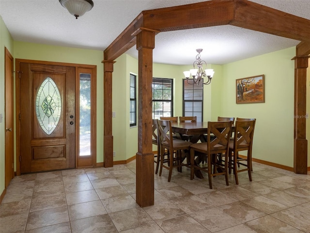 113 Myrtlewood Point Rd, East Palatka, FL 32131 - entrance foyer featuring a chandelier, baseboards, and a textured ceiling