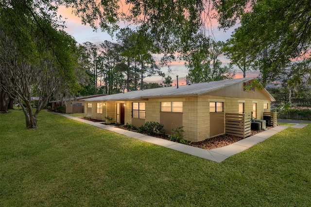 915 NW 40th Ave, Gainesville, Fl, FL 32605 - view of front of house with a front lawn and metal roof