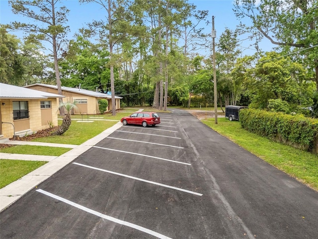 915 NW 40th Ave, Gainesville, Fl, FL 32605 - uncovered parking lot with view of scattered trees