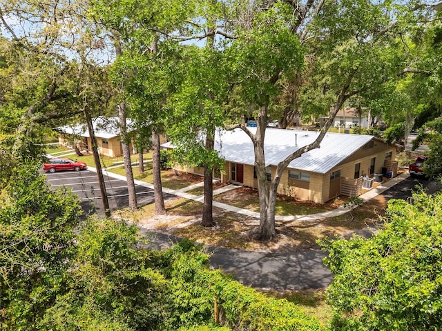 915 NW 40th Ave, Gainesville, Fl, FL 32605 - back of property with uncovered parking and metal roof