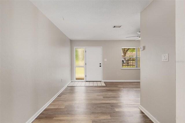 915 NW 40th Ave, Gainesville, Fl, FL 32605 - entrance foyer featuring wood finished floors, baseboards, and a ceiling fan