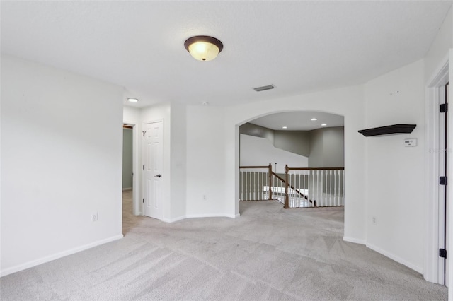 1726 Chatham Village Dr, Fleming Island, FL 32003 - spare room with carpet floors, arched walkways, and baseboards