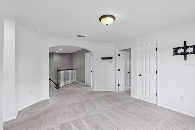 1726 Chatham Village Dr, Fleming Island, FL 32003 - carpeted empty room with arched walkways, baseboards, and a smoke detector