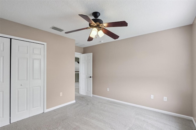 1726 Chatham Village Dr, Fleming Island, FL 32003 - unfurnished bedroom featuring light carpet, baseboards, a closet, and ceiling fan
