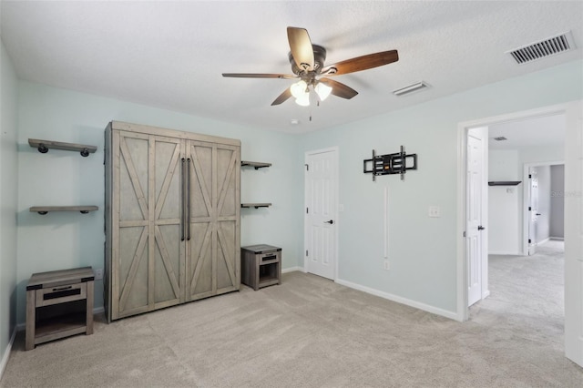 1726 Chatham Village Dr, Fleming Island, FL 32003 - unfurnished bedroom featuring light carpet, baseboards, and a ceiling fan
