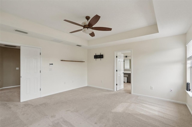 1726 Chatham Village Dr, Fleming Island, FL 32003 - unfurnished room with ceiling fan, light colored carpet, baseboards, and a raised ceiling