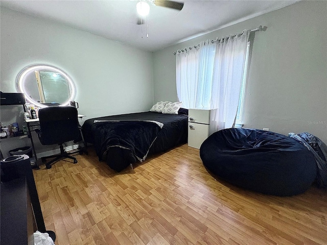4000 SW 23rd St Unit 3-205, Gainesville, FL 32608 - bedroom featuring light wood finished floors and a ceiling fan