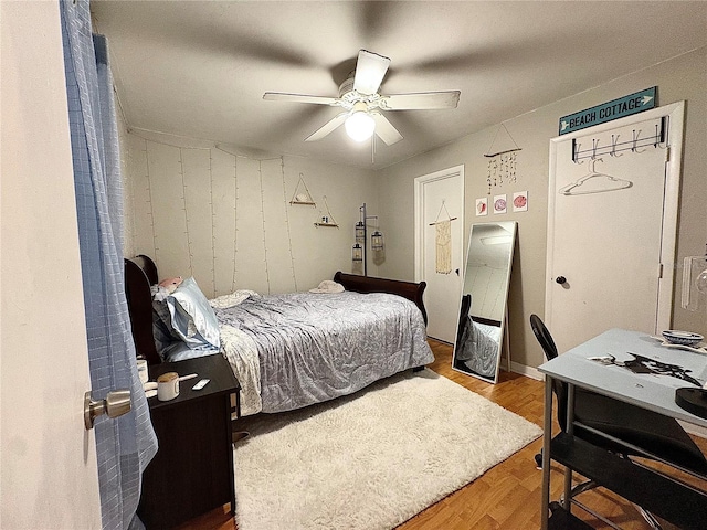 4000 SW 23rd St Unit 3-205, Gainesville, FL 32608 - bedroom with wood finished floors and ceiling fan