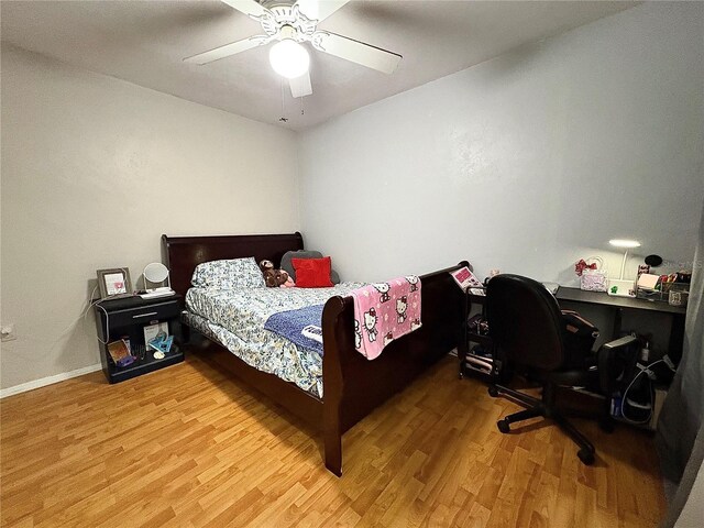 4000 SW 23rd St Unit 3-205, Gainesville, FL 32608 - bedroom featuring light wood-style floors, ceiling fan, baseboards, and an office area