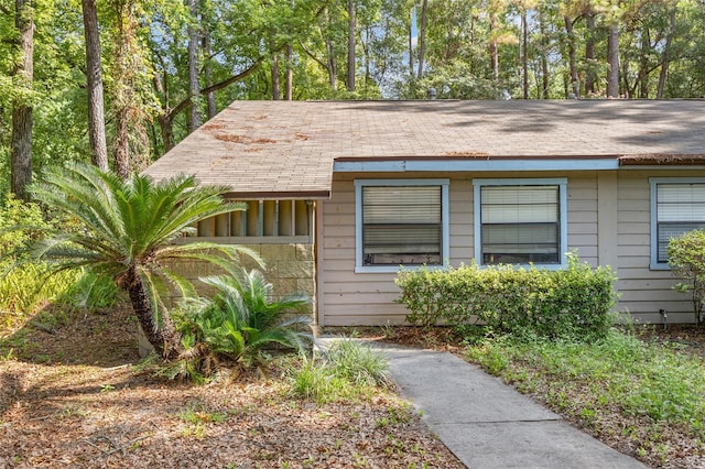 6912 SW 45th Ave, Gainesville, FL 32608 - view of side of home with roof with shingles