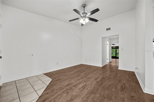 6912 SW 45th Ave, Gainesville, FL 32608 - empty room featuring wood finished floors, ceiling fan, and baseboards