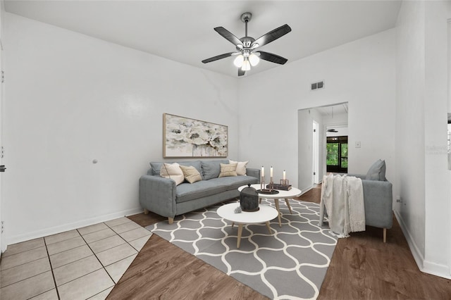6912 SW 45th Ave, Gainesville, FL 32608 - living area featuring ceiling fan, wood finished floors, and baseboards