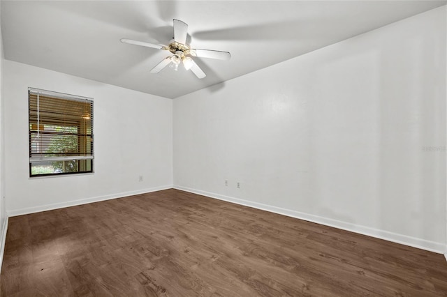 6912 SW 45th Ave, Gainesville, FL 32608 - spare room with dark wood-style floors, baseboards, and ceiling fan