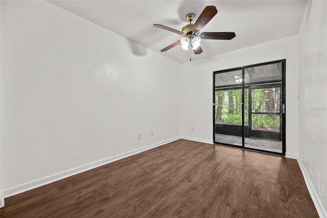 6912 SW 45th Ave, Gainesville, FL 32608 - unfurnished room with dark wood-style flooring, baseboards, and a ceiling fan