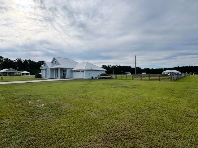 6180 SW 83rd Pl, Trenton, FL 32693 - view of yard with a garage