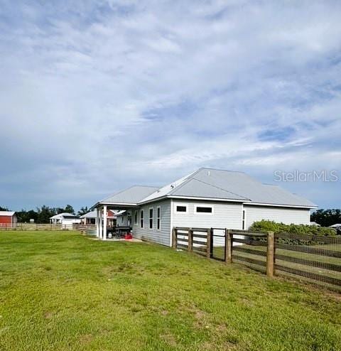 6180 SW 83rd Pl, Trenton, FL 32693 - view of home's exterior featuring a patio area