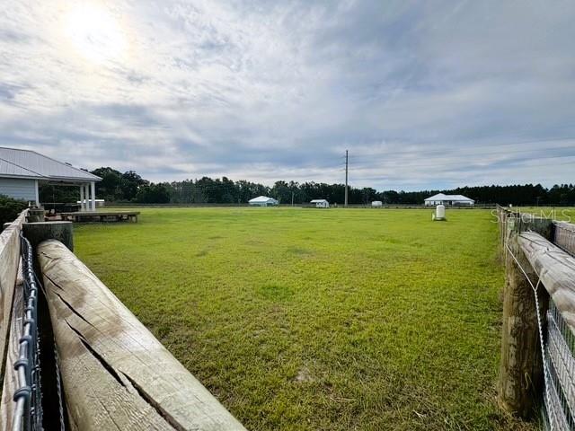 6180 SW 83rd Pl, Trenton, FL 32693 - view of green lawn with a view of countryside