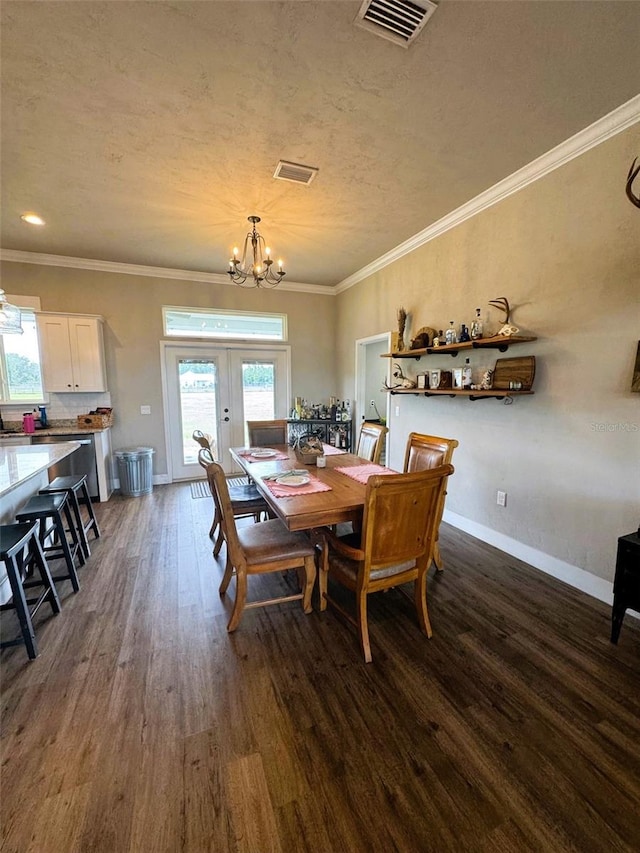 6180 SW 83rd Pl, Trenton, FL 32693 - dining room featuring dark wood-style floors, a chandelier, baseboards, french doors, and ornamental molding