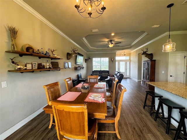 6180 SW 83rd Pl, Trenton, FL 32693 - dining area with a raised ceiling, dark wood-type flooring, baseboards, ceiling fan, and ornamental molding