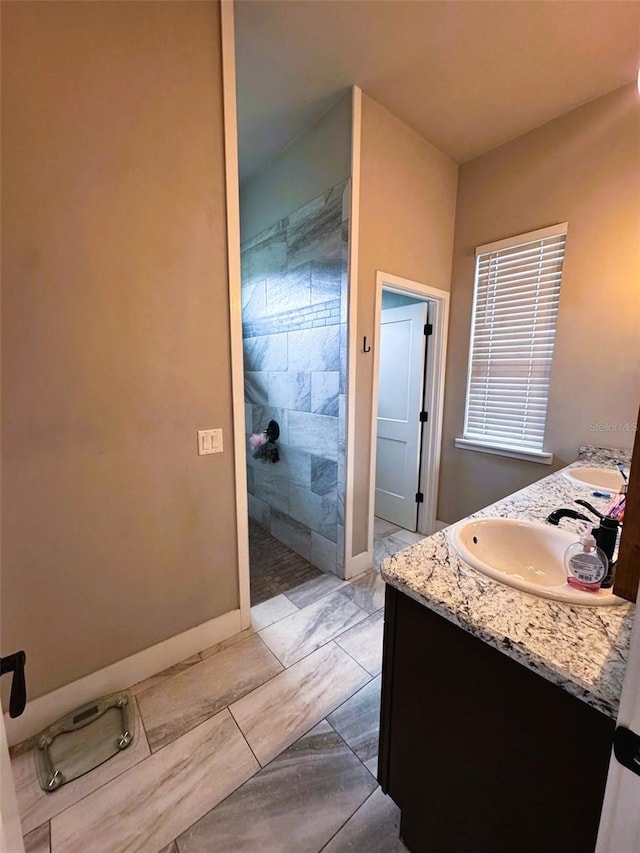 6180 SW 83rd Pl, Trenton, FL 32693 - bathroom with marble look tile flooring, double vanity, and a walk in shower
