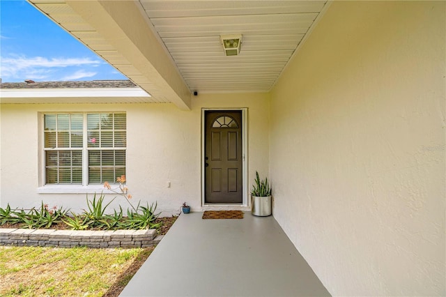 680 NW 67th Pl, Ocala, FL 34475 - view of exterior entry with stucco siding