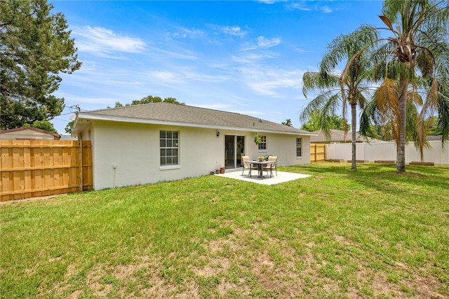680 NW 67th Pl, Ocala, FL 34475 - rear view of property with stucco siding and a patio area