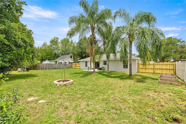 680 NW 67th Pl, Ocala, FL 34475 - view of yard with an outdoor fire pit