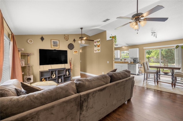 680 NW 67th Pl, Ocala, FL 34475 - living area featuring a ceiling fan, lofted ceiling, dark wood-style floors, and baseboards