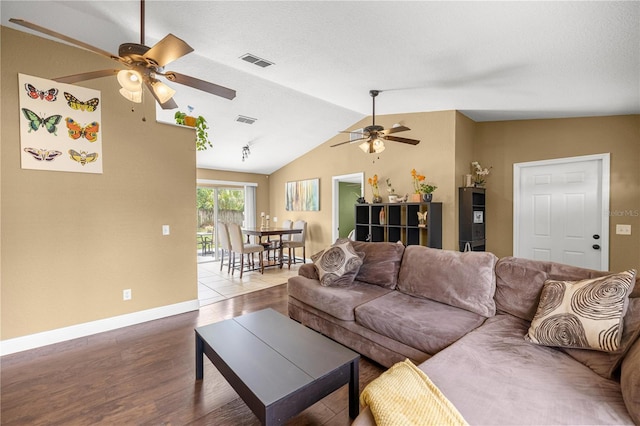 680 NW 67th Pl, Ocala, FL 34475 - living room with a ceiling fan, wood finished floors, vaulted ceiling, and baseboards