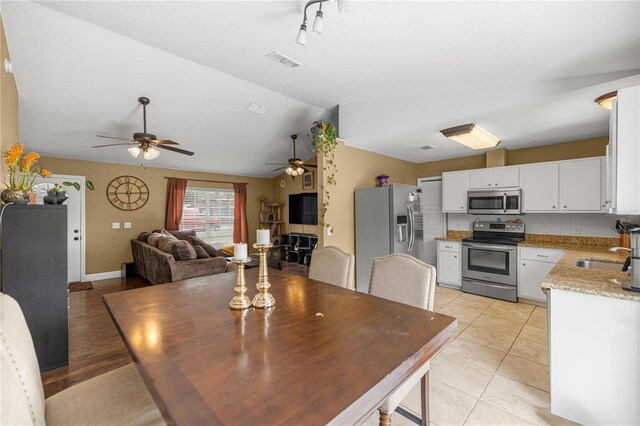 680 NW 67th Pl, Ocala, FL 34475 - dining room with lofted ceiling and ceiling fan