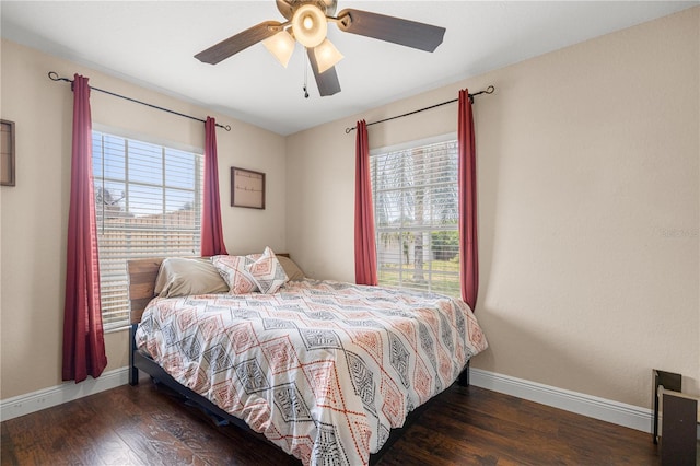 680 NW 67th Pl, Ocala, FL 34475 - bedroom with multiple windows, baseboards, and wood finished floors