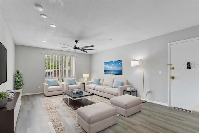 1700 SW 16th Ct Unit J21, Gainesville, FL 32608 - living area featuring wood finished floors, ceiling fan, baseboards, and recessed lighting