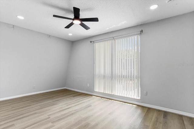 1700 SW 16th Ct Unit J21, Gainesville, FL 32608 - spare room featuring a ceiling fan, wood finished floors, baseboards, and recessed lighting