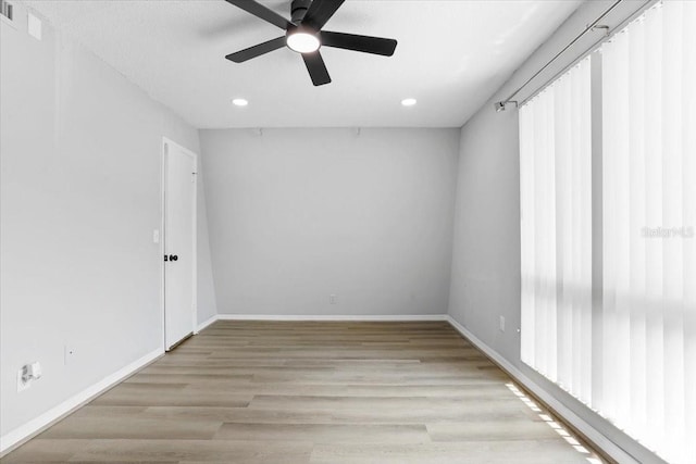 1700 SW 16th Ct Unit J21, Gainesville, FL 32608 - empty room with a ceiling fan, recessed lighting, light wood-style flooring, and baseboards