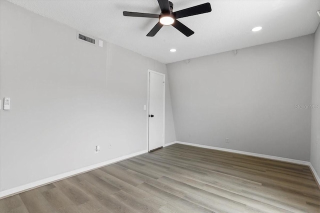 1700 SW 16th Ct Unit J21, Gainesville, FL 32608 - spare room featuring ceiling fan, wood finished floors, baseboards, and recessed lighting