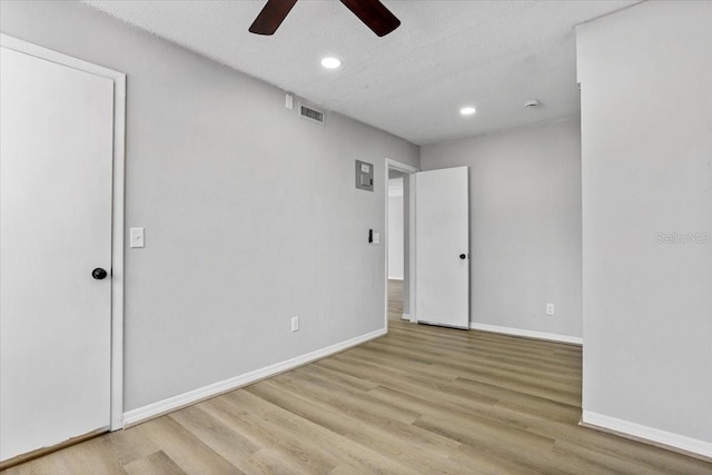 1700 SW 16th Ct Unit J21, Gainesville, FL 32608 - spare room with a ceiling fan, recessed lighting, wood finished floors, baseboards, and a textured ceiling