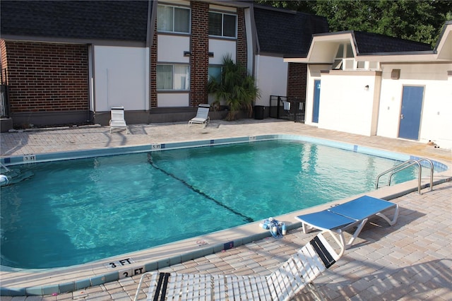 1700 SW 16th Ct Unit J21, Gainesville, FL 32608 - community pool with a patio