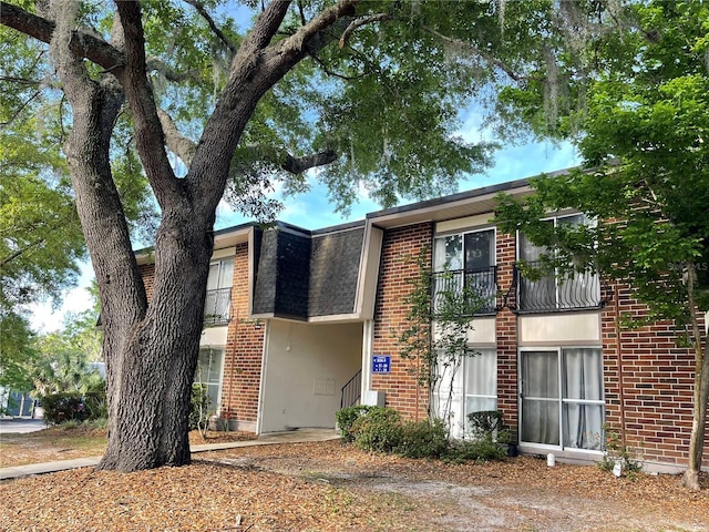1700 SW 16th Ct Unit D30, Gainesville, FL 32608 - view of front of house featuring brick siding and a balcony